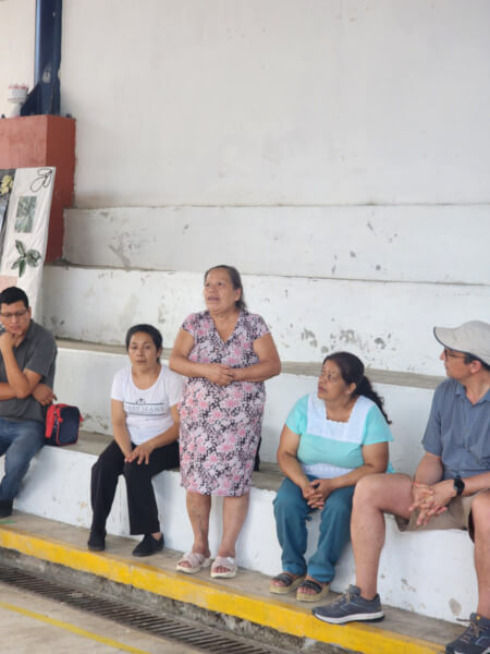 People from the local Mexican community talking in the street.