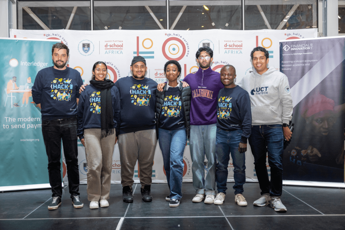 Students from Team Fin Illuminaries with judge Raul Ranete on the left and Dr Allan Davids on the right.